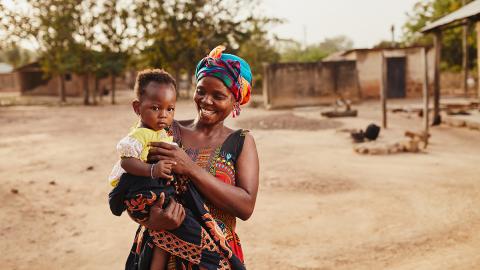 Mother with young baby in her arms